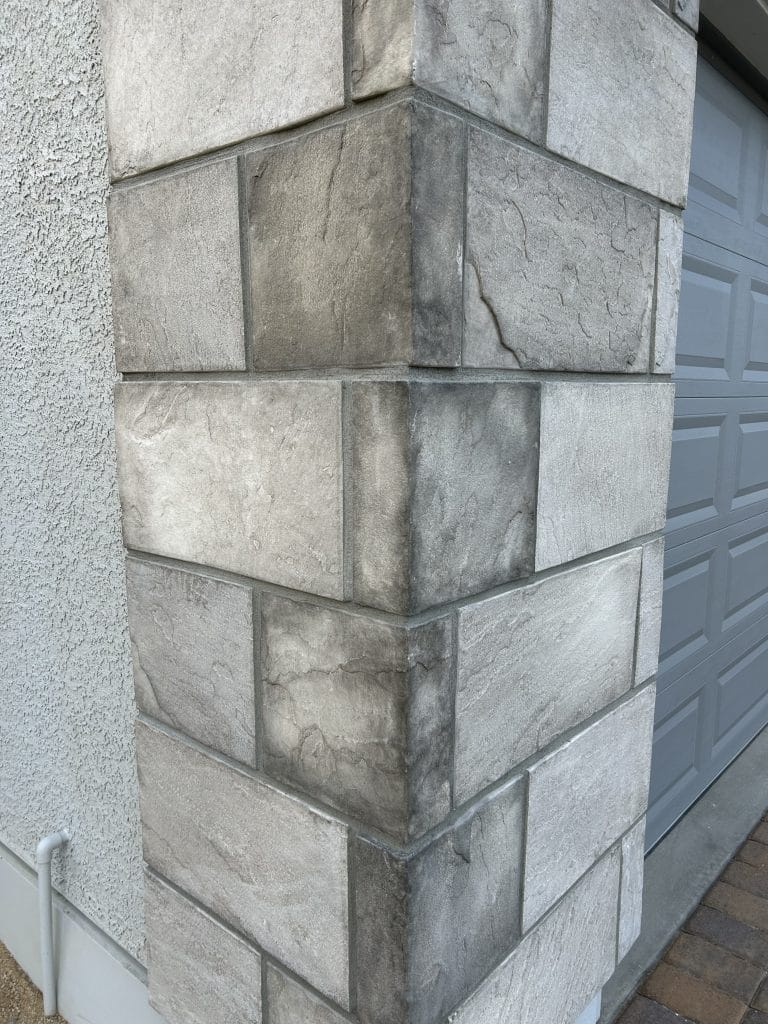 A gray block masonry pillar work in Cedar Rapids